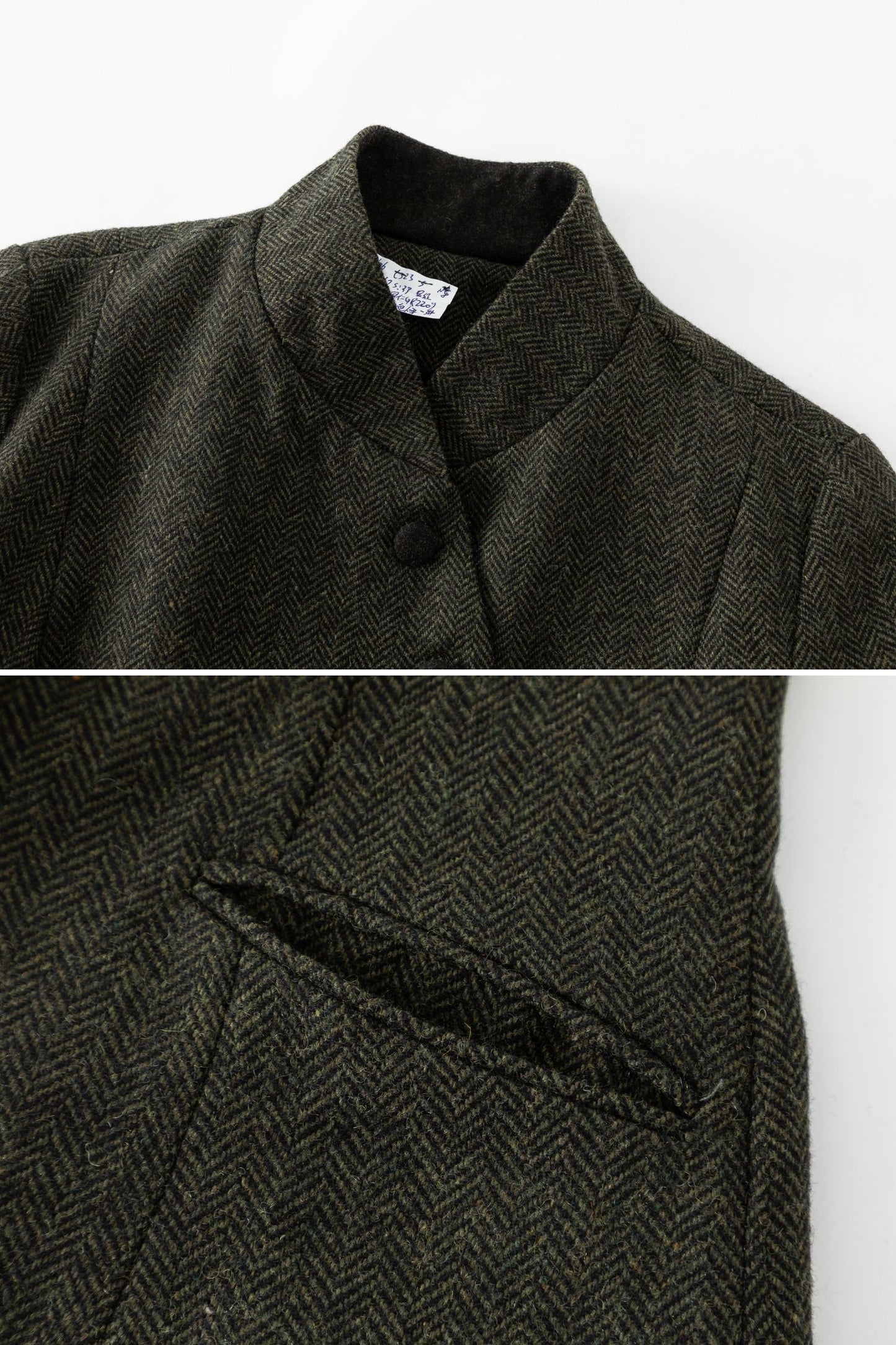 Dark green herringbone patterned coat with buttons on a white background