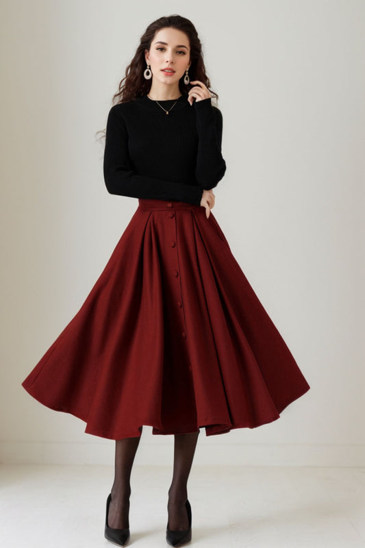 woman wearing burgundy handmade wool pleated midi skirt with swing silhouette