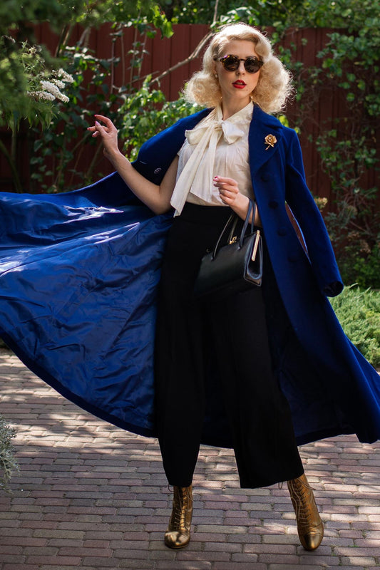 Woman wearing blue wool maxi coat with double breasted design