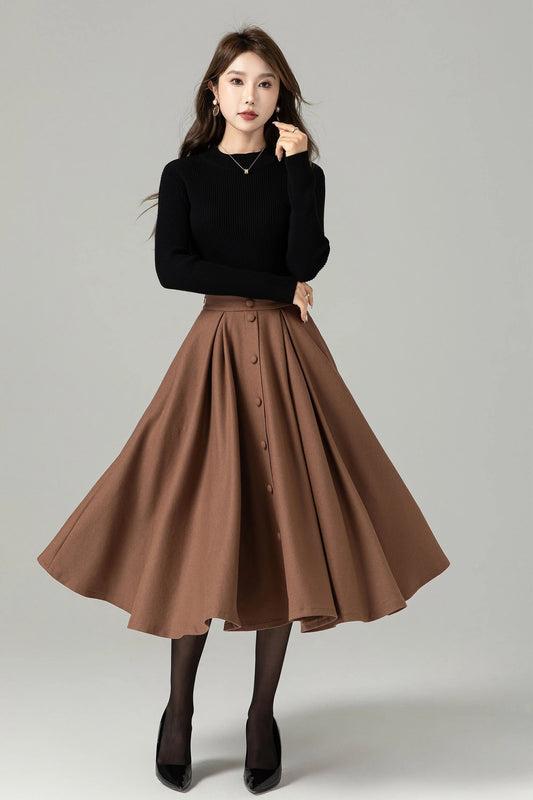 May include: A brown midi skirt with a button front and a flared silhouette.