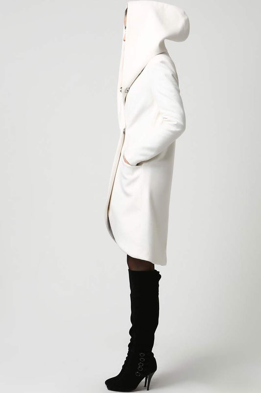 Model wearing a white oversized-hood wool coat with asymmetrical hem