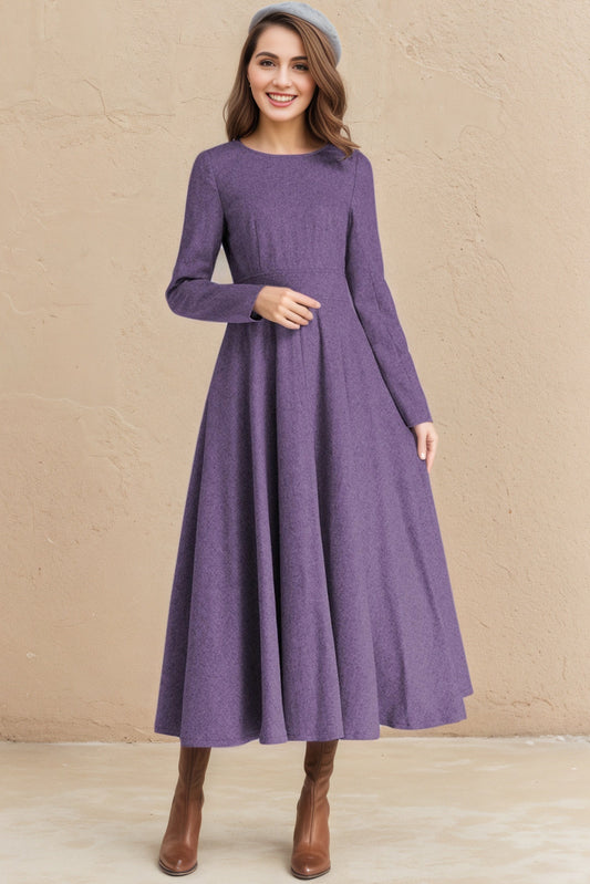 Woman wearing a long-sleeve purple dress against a beige background