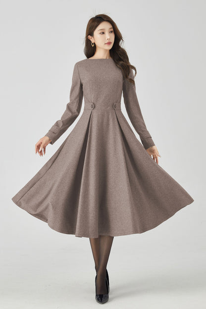 Woman wearing a brown dress on a white background