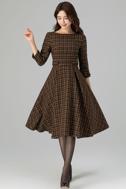 Woman wearing brown plaid wool fit-and-flare midi dress with 3/4 sleeves