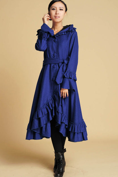 Elegant long hooded wool overcoat in royal blue with tie belt and ruffled hem