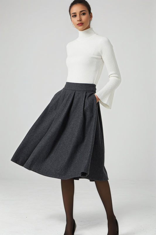 Woman wearing a white turtleneck and gray skirt on a white background