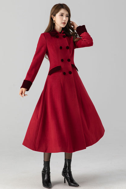A woman modeling a red double-breasted, long-sleeved wool coat with a V-neck collar and two side seam pockets.