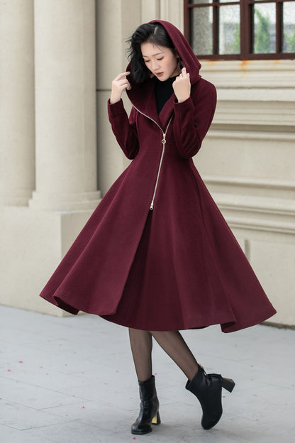 Woman wearing burgundy handmade hooded wool coat with zipper closure