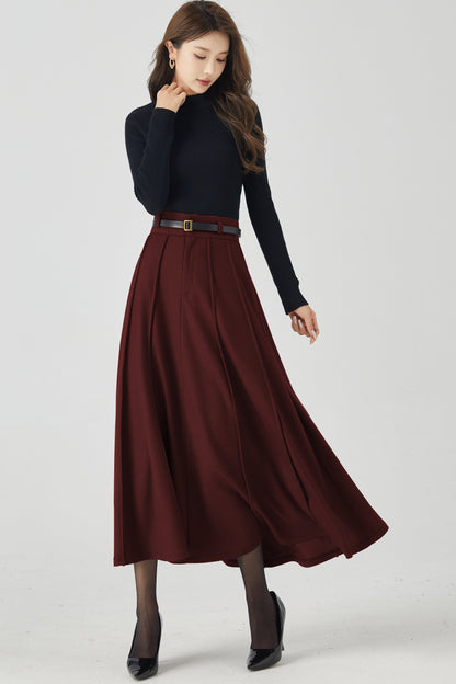 Woman wearing a black turtleneck and burgundy skirt on a white background