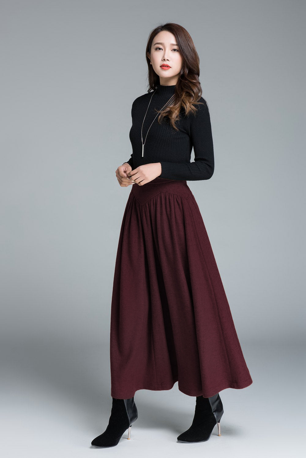 Vintage-inspired burgundy flared wool skirt styled for winter
