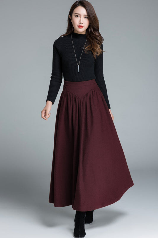 Woman wearing burgundy wool maxi skirt with high waist