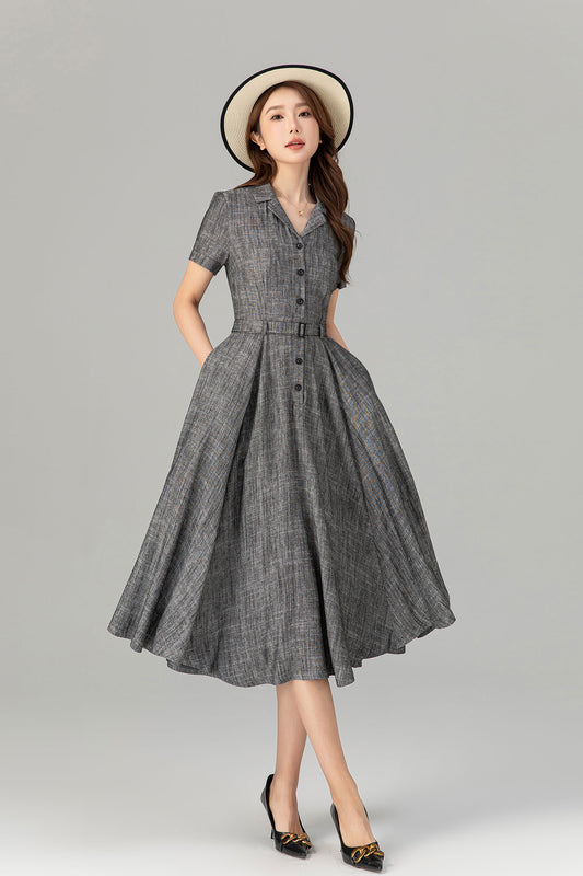 Asian model wearing gray linen shirt dress with belt and swing skirt
