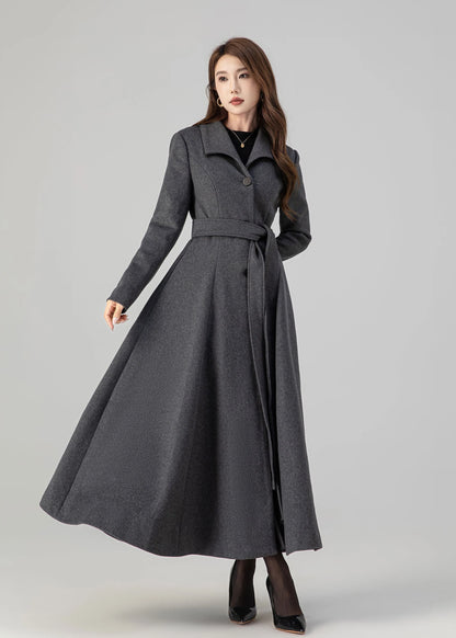 May include: A long gray coat with a belt and a single button closure. The coat has a flared skirt and a collar.