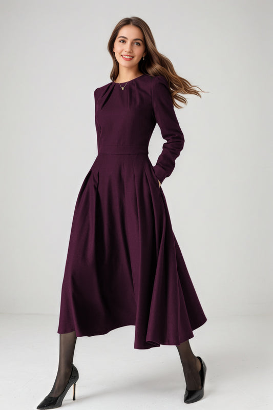 Woman wearing a purple dress on a white background