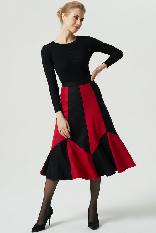 Woman wearing a black and red dress on a white background