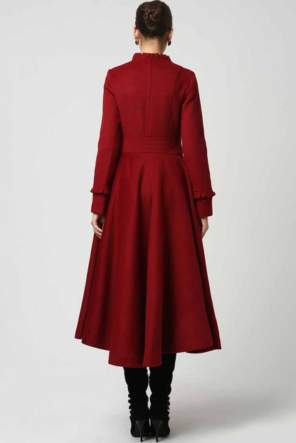 Vintage-inspired red wool coat with long sleeves and fabric buttons