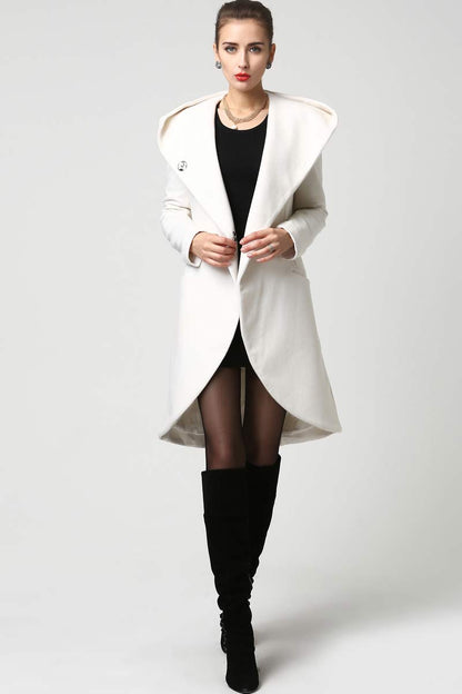 White wool blend coat featuring draped hood and scalloped drop-hem design