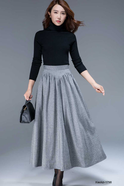 Woman wearing gray wool maxi skirt with high waist