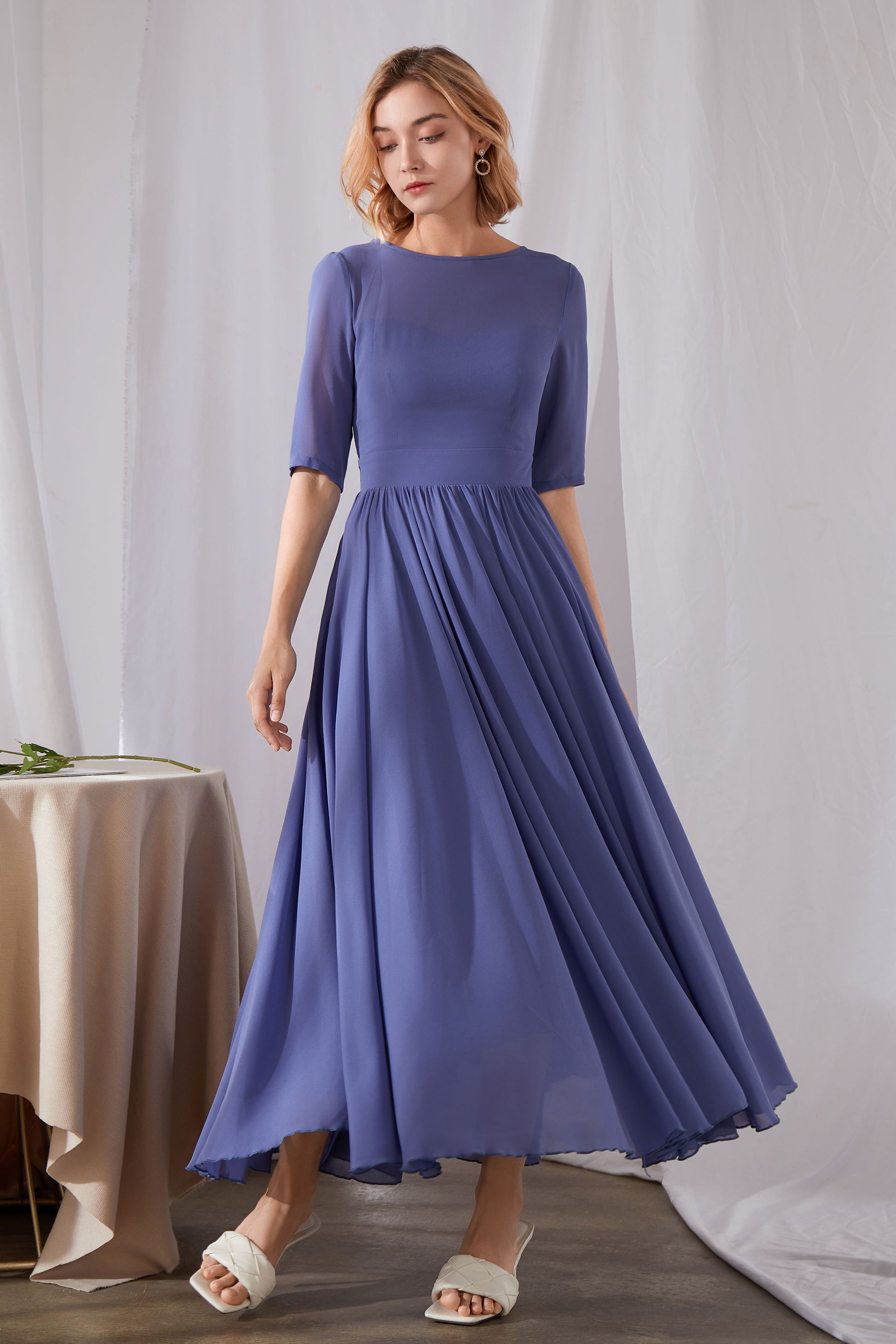 blue pleated chiffon dress Blue pleated chiffon gown with pink sash