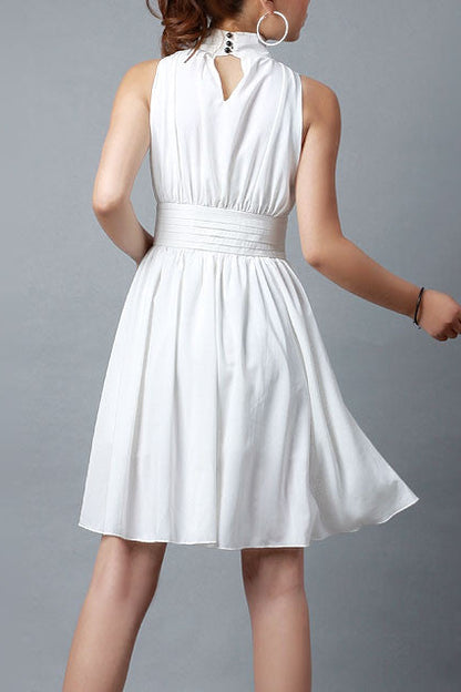 White dress worn by a person on a gray background